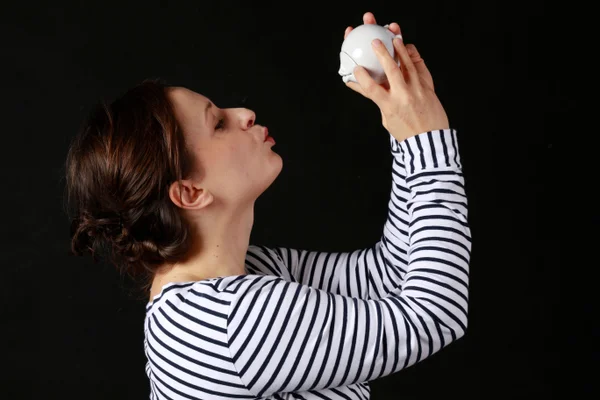 Katarzyna Woźniak holding one of her artworks